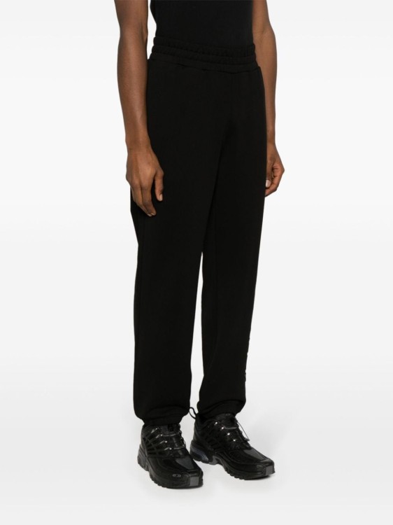 Shop Moncler Embroidered Logo Trousers In Black