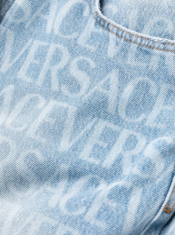 Shop Versace Allover Logo-print Jeans In Blue