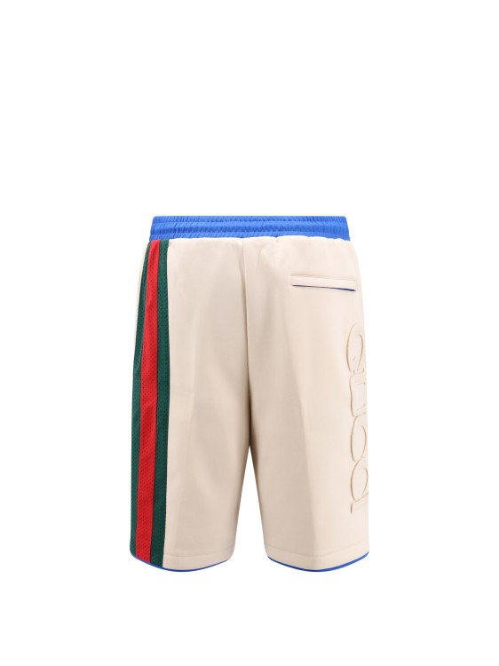 Shop Gucci Embossed Logo Jersey Bermuda Shorts In Neutrals