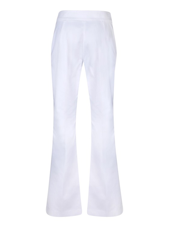 Shop Genny Flared Cut Cotton Trousers In White