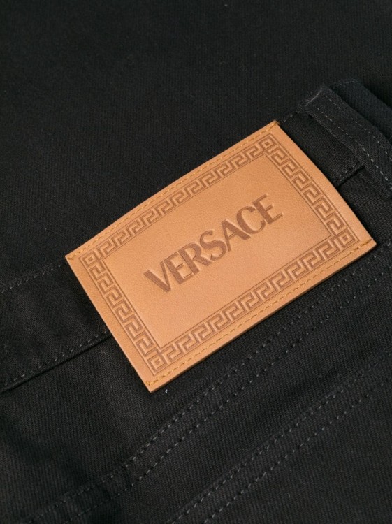 Shop Versace Mid-rise Straight-leg Jeans In Black