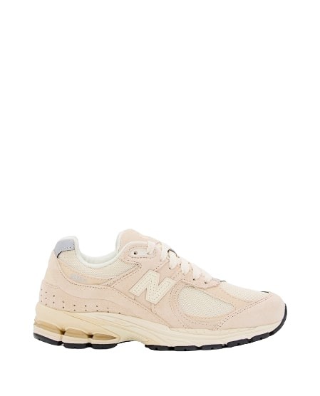 Shop New Balance 2002r Sneakers In White
