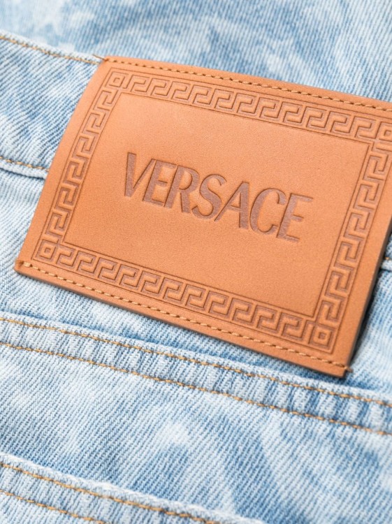 Shop Versace Allover Logo-print Jeans In Blue