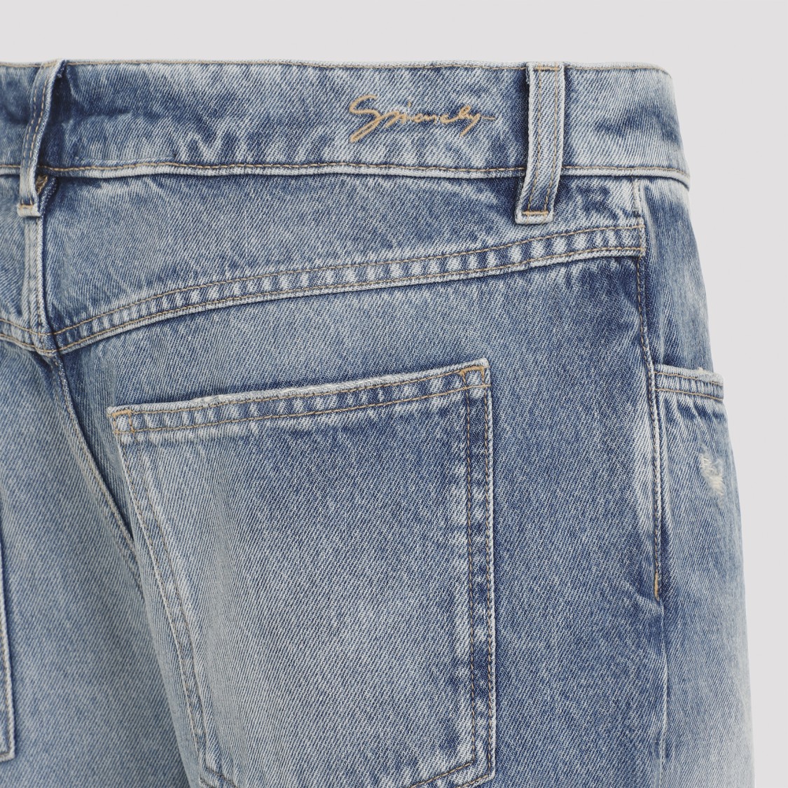 Givenchy Washed Denim Tapered Leg Jeans With Contrast Stitching In Blue