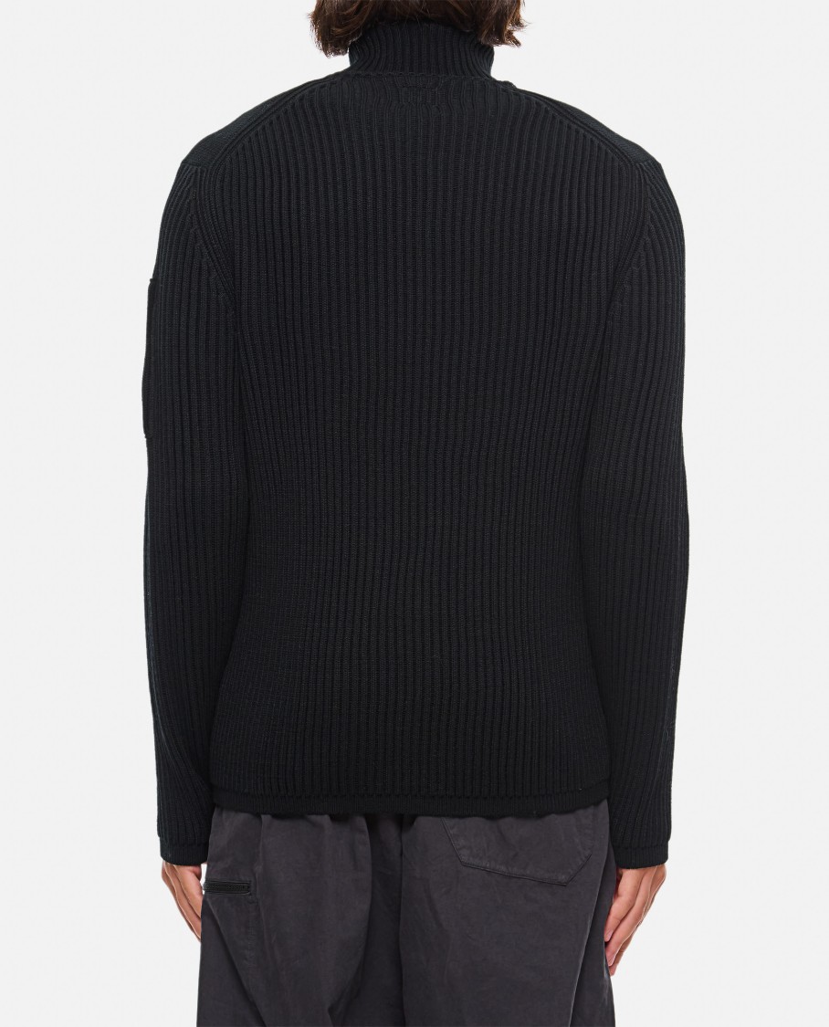 C.p. Company Ribbed Knit Roll Neck Sweater With Signature Lens Detail And Zip Pocket In Black